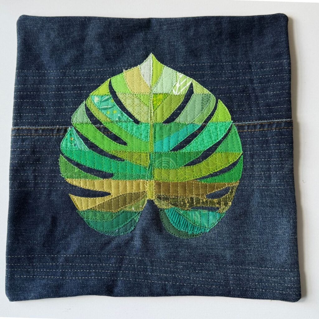 monstera collage quilt green on denim